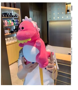 Cute pink plush dinosaur crossbody bag for women with a yellow adjustable shoulder strap