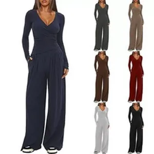 Elegant V-neck long sleeve jumpsuit with wide leg design, available in multiple colors.