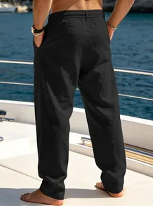 Back view of men's loose breathable black straight-leg casual beach pants on boat