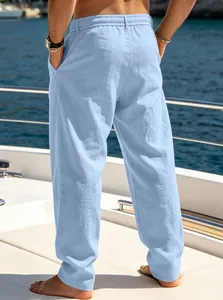 Back view of men's light blue breathable linen-textured casual beach pants on a yacht