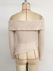 Detailed back view of an apricot off-shoulder ribbed knit top featuring an irregular hemline