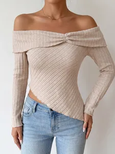 Close-up of off-the-shoulder ribbed knit top with asymmetrical hem and long sleeves