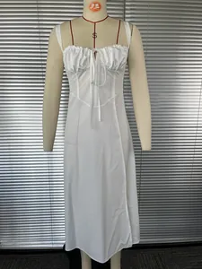 Front view of white French style sleeveless dress with ruffle bust and side slit on mannequin
