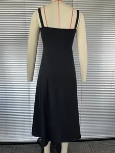 Detailed back view of a minimalist black French-style sleeveless midi slip dress
