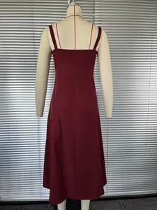 Detailed back view of an elegant burgundy French style camisole midi dress on a mannequin