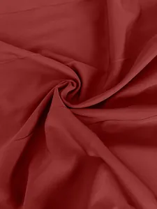 Macro shot of smooth deep red fabric material for elegant French style camisole dress