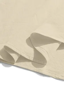 Detailed view of beige cotton linen fabric and stitching on men's casual shirt