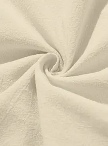 Macro detail showing the breathable texture of beige linen cotton shirt fabric material