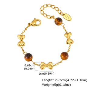 Detailed gold butterfly charm bracelet with tiger eye beads showing length and weight