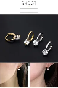 Elegant sparkling zirconia hoop earrings in gold and silver finishes shown on models