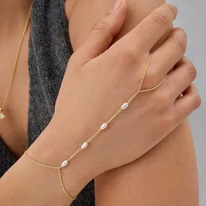 Elegant 16k gold plated hand chain bracelet with white pearl accents for women