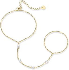 Detail view of 16K gold plated hand harness bracelet with elegant white pearls