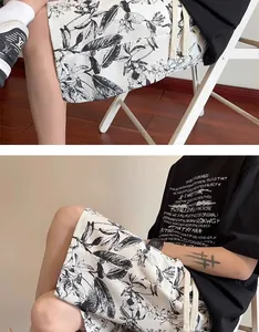 Detailed view of men's ink-print casual shorts with loose fit for summer beach wear.