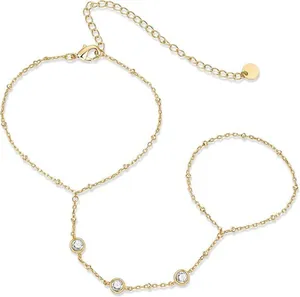 Elegant 16k gold plated finger bracelet with three bezel-set cubic zirconia stones.