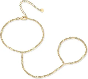 Detail of 16K gold plated hand chain bracelet featuring minimalist patterned links