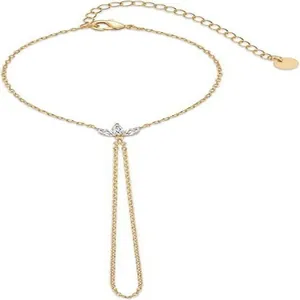 Detail view of a 16k gold plated finger bracelet with marquise crystal centerpiece.