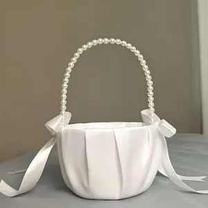 Elegant white satin flower girl basket with pearl handle and silk ribbon bows