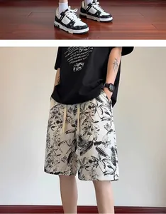 Close-up detail of men's ink-pattern quick-dry beach shorts featuring a relaxed loose fit