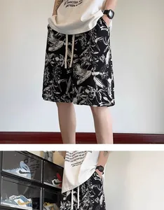 Detailed view of men's quick-dry ink wash printed shorts with drawstring waist.