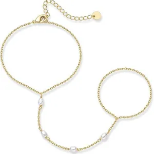 Minimalist 16k gold plated hand harness ring bracelet with elegant white pearls.