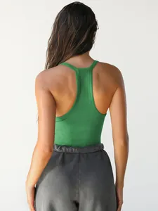 Close-up of the racerback design on a green ribbed knit slim fit tank top for women.