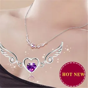 Detailed view of silver angel wings necklace with purple heart gemstone