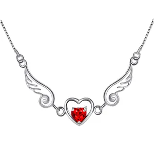 Close-up of silver angel wings necklace with a heart-shaped red gemstone pendant