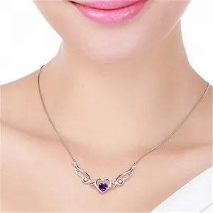 Elegant silver necklace featuring angel wings and a purple heart-shaped gemstone pendant