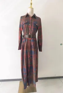 Detailed view of French retro plaid maxi dress featuring waist belt and long sleeves