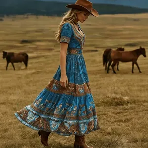 Elegant bohemian blue maxi dress featuring ethnic prints in a vintage ranch outdoor setting