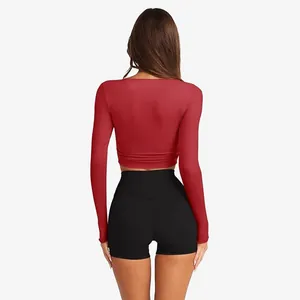 Close-up back view of a slim fit red long sleeve knit crop top for active women