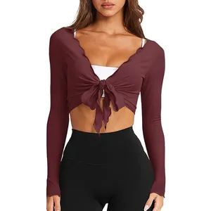 Women's burgundy long-sleeve cropped knit top with a stylish front tie knot detail