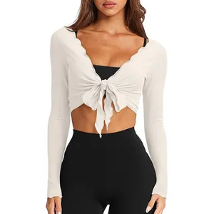 Detailed view of white slim fit v-neck knotted long sleeve knit crop top for women