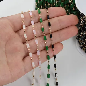 Close-up of colorful rectangular crystal beads and 14K gold filled chains for DIY jewelry