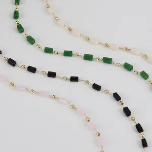 Detail of four colors 14K gold-filled crystal square bead chains for DIY jewelry crafts