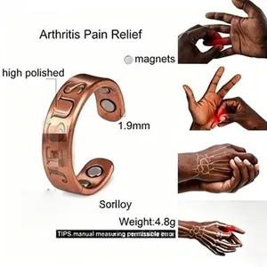 Detail view of copper magnetic therapy ring with engraved Jesus text for pain relief