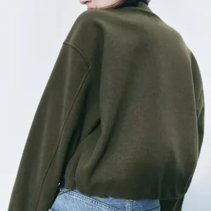 Back view of army green soft casual jacket with boxy fit and ribbed hem detail