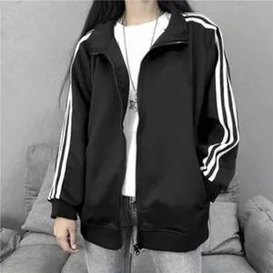 Classic black zip-up sports jacket featuring three white stripes on the sleeves.