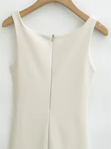 Detail view of cream sleeveless elegant dress back with invisible zipper closure