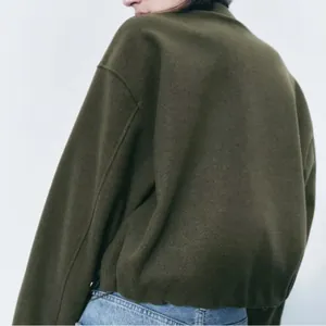Back view of a soft olive green round neck casual jacket for women early autumn