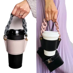 Close-up of leather coffee cup sleeve with a detachable chunky chain handle
