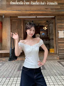 Vintage style white floral off-the-shoulder top with ruffled trim and slim fit design.