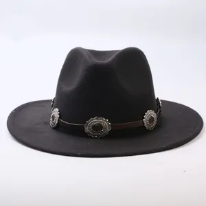 Detailed view of a vintage black felt fedora hat featuring a silver metal concho band