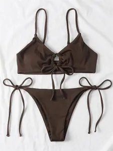 Close-up detail of a dark brown ribbed bikini set with tie-front and side-tie strings