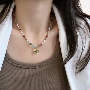 Handmade natural stone beaded necklace with a golden elephant pendant for women