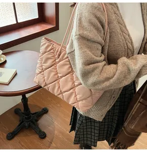 Pink quilted cotton padded tote bag for women shown in a lifestyle setting