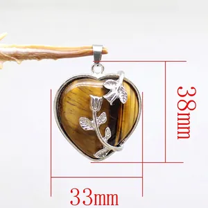 Heart-shaped tiger eye stone pendant with silver rose flower detail, 38mm x 33mm.
