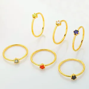 Detailed set of six-prong stainless steel rings with round colorful cubic zirconia