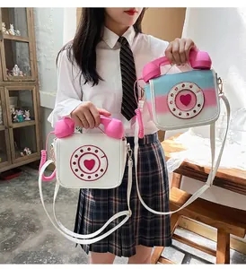 Creative vintage telephone shaped crossbody bag in white and pink-blue gradient.