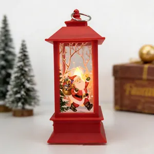 Detailed view of red Christmas LED lantern with Santa Claus illustration and ring